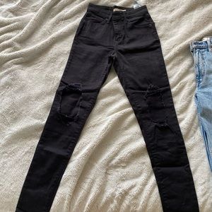 Levi’s high rise black ripped jeans